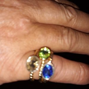 Set of three rings sz. 7 gold tone and gem s are different coloe